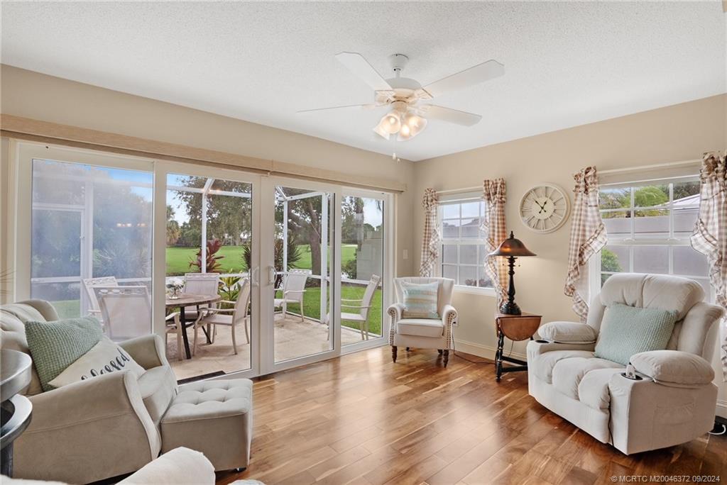 1663 Southwest Springfield Court Palm City, FL 34990 - Photo 5 of 27 a living room with furniture and a large window