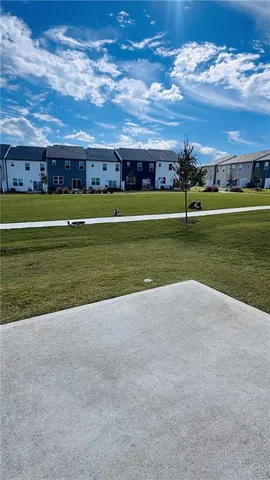 a view of a golf course with a big yard