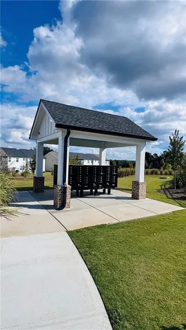 a view of house with outdoor space and swimming pool
