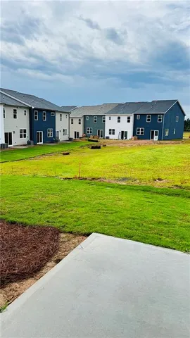 a house view with a sitting space and garden view