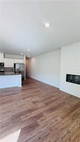 a view of kitchen and empty room