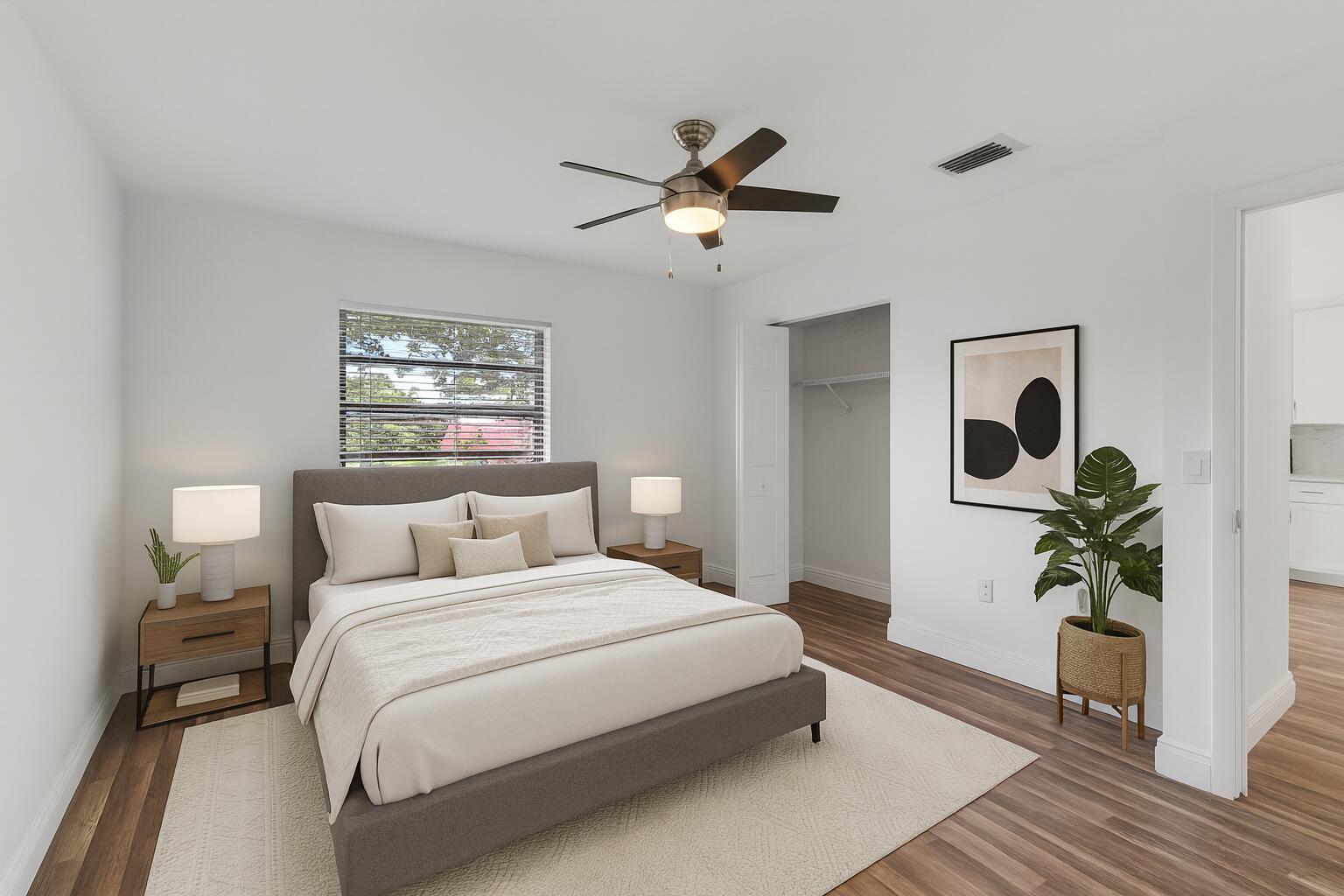 8536 Casa Del Lago, Unit 49B Boca Raton, FL 33433 - Photo 40 of 79 a bedroom with bed and a potted plant