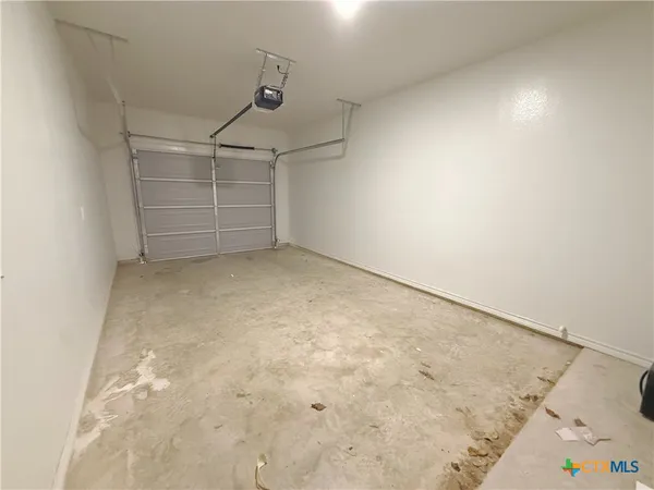 an empty room with shelves