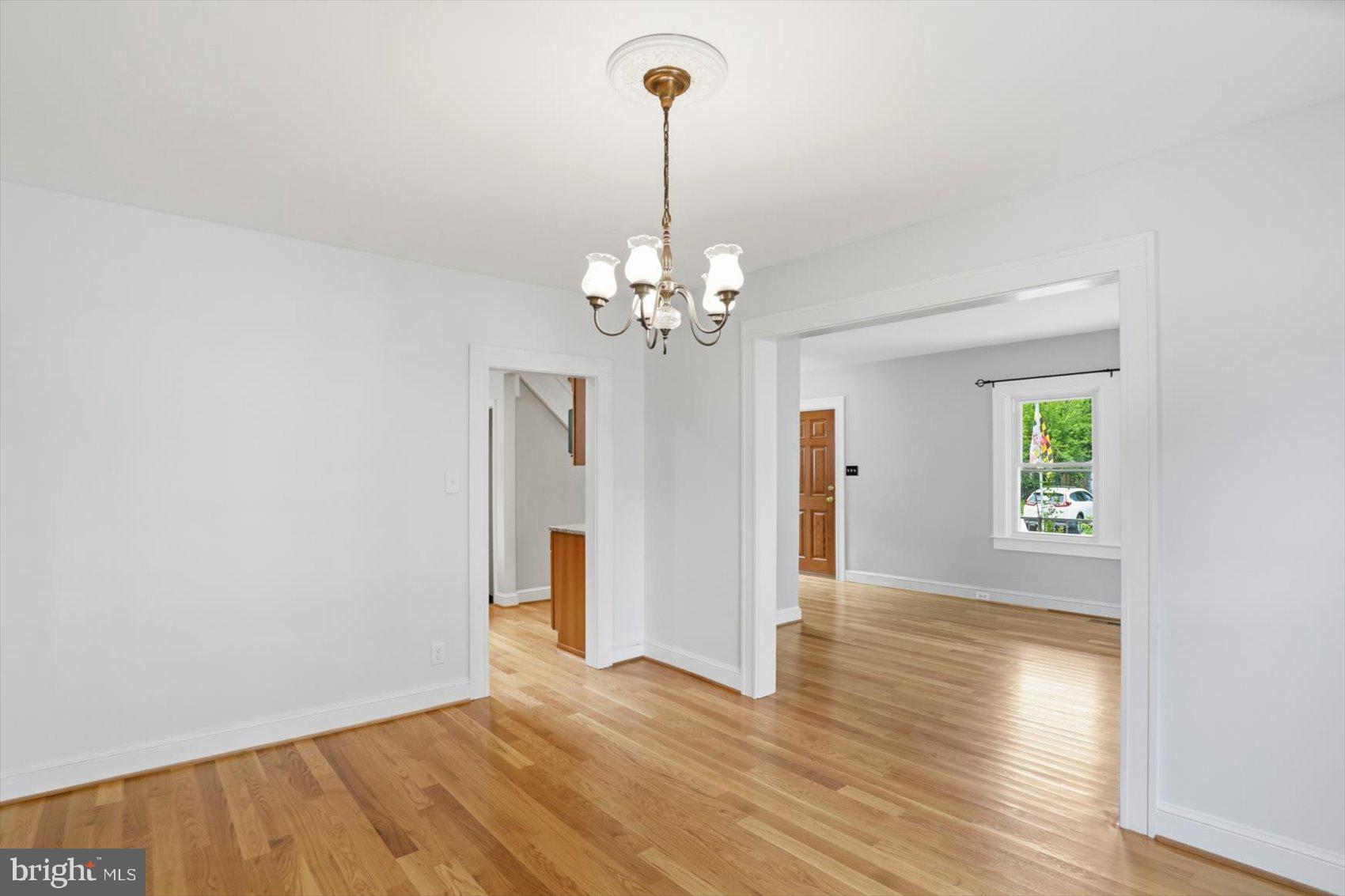 24 Normal Terrace Baltimore, MD 21286 - Photo 10 of 37 a view of a livingroom with wooden floor and a chandelier