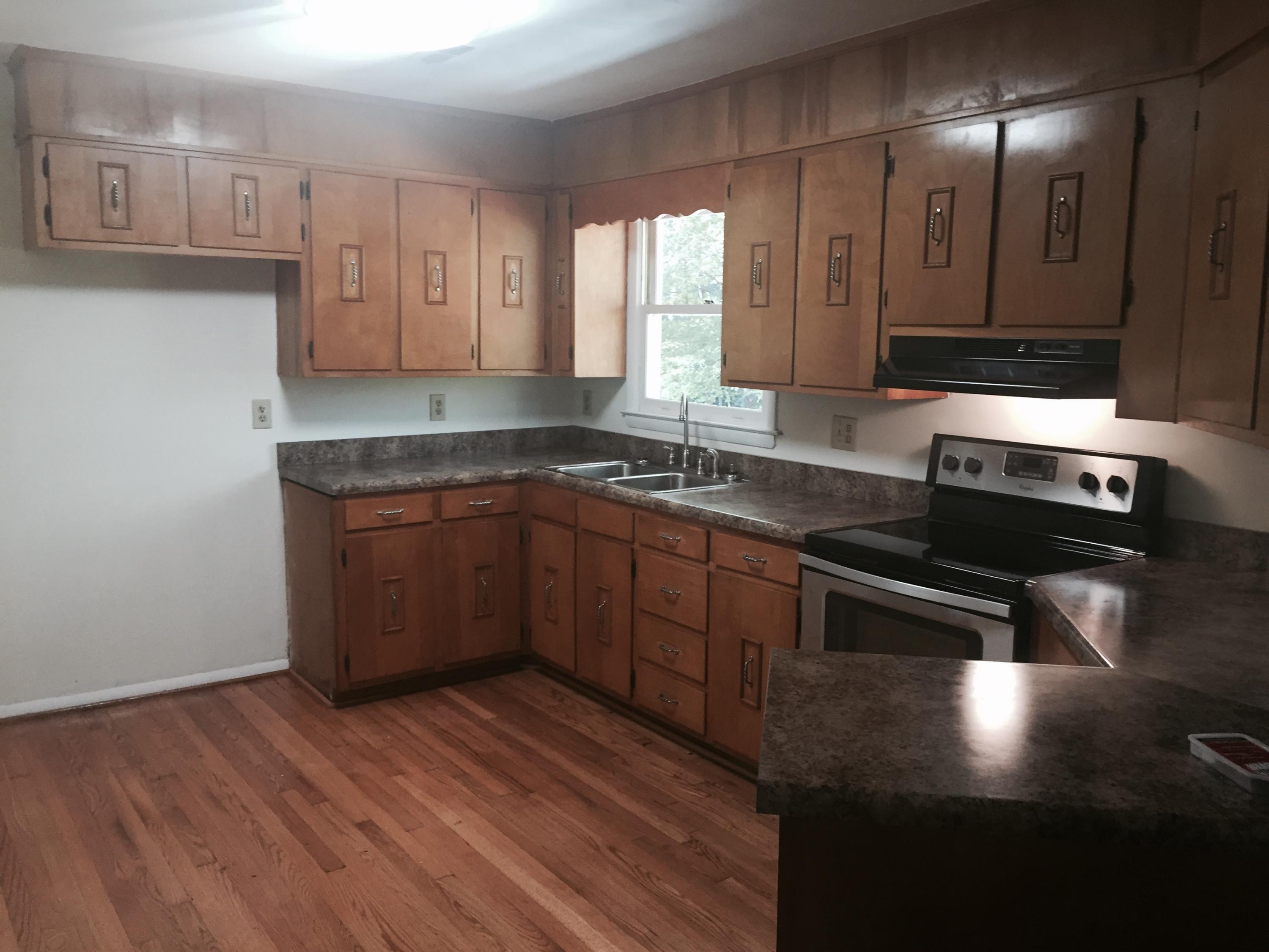 884 Isolane Road Callaway, VA 24067 - Photo 7 of 10 a kitchen with stainless steel appliances granite countertop a sink stove and cabinets