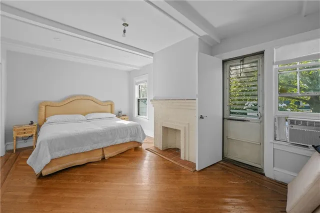 a bedroom with a bed and a fireplace