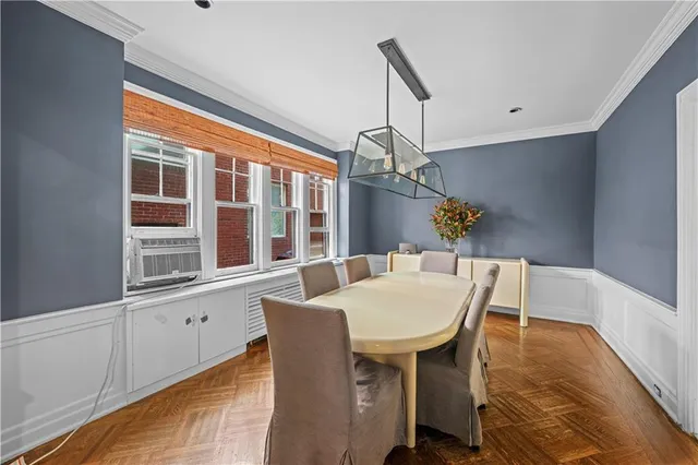 a view of a dining room with furniture window and wooden floor