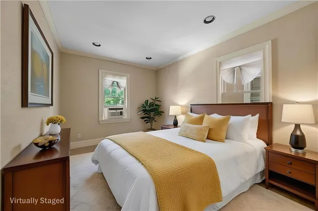 a bedroom with a bed and window