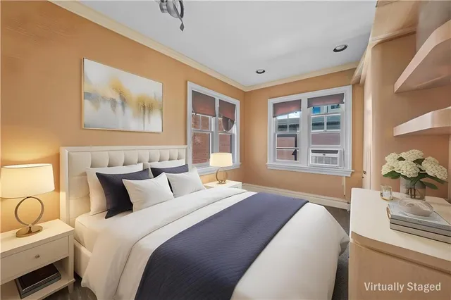 a bedroom with bed and wooden floor