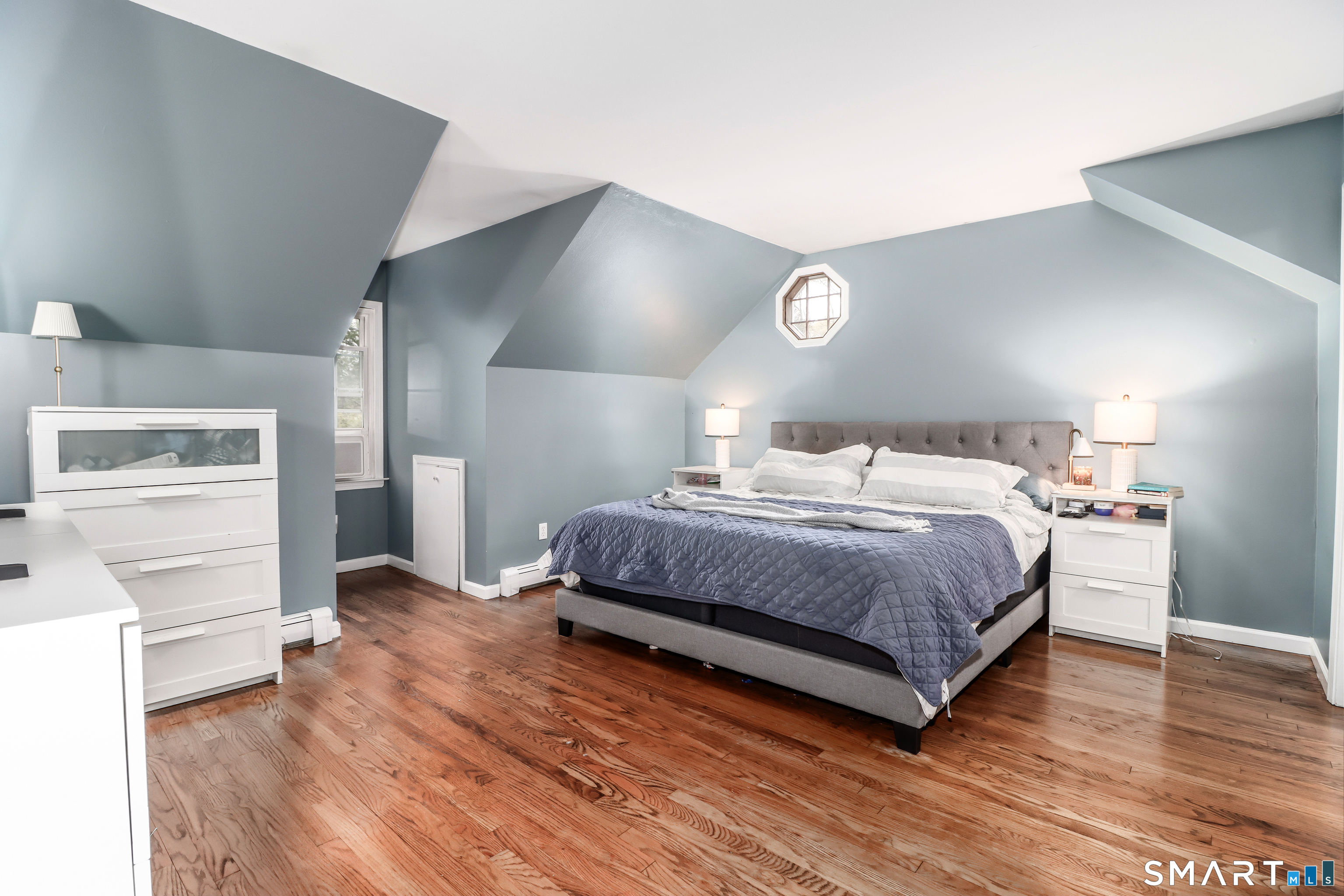 20 Puritan Valley Road Brookfield, CT 06804 - Photo 18 of 35 a bedroom with a bed and wooden floor
