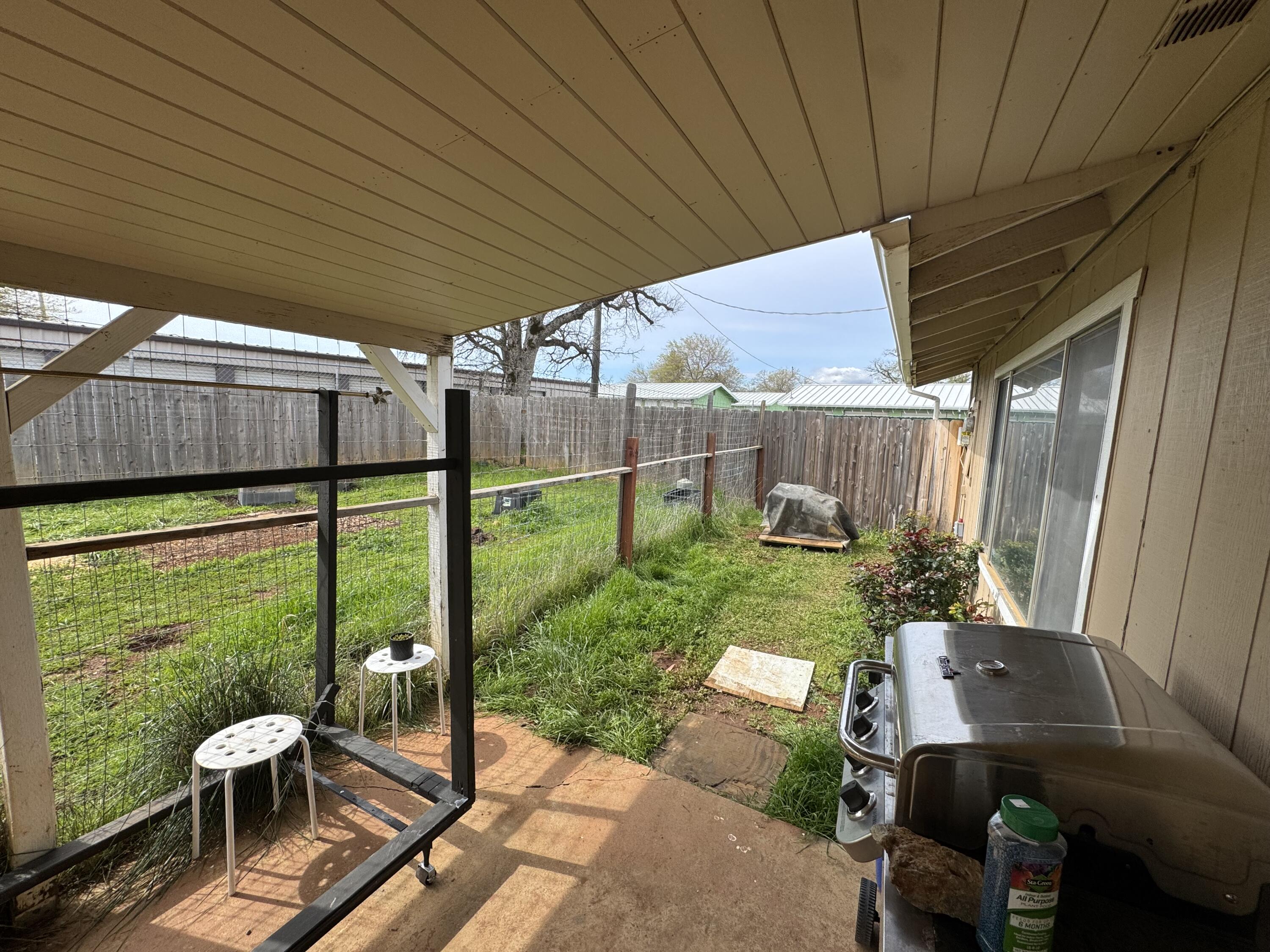 2971-2951 Tarmac Road Redding, CA 96003 - Photo 23 of 32 a patio with yard table and chairs