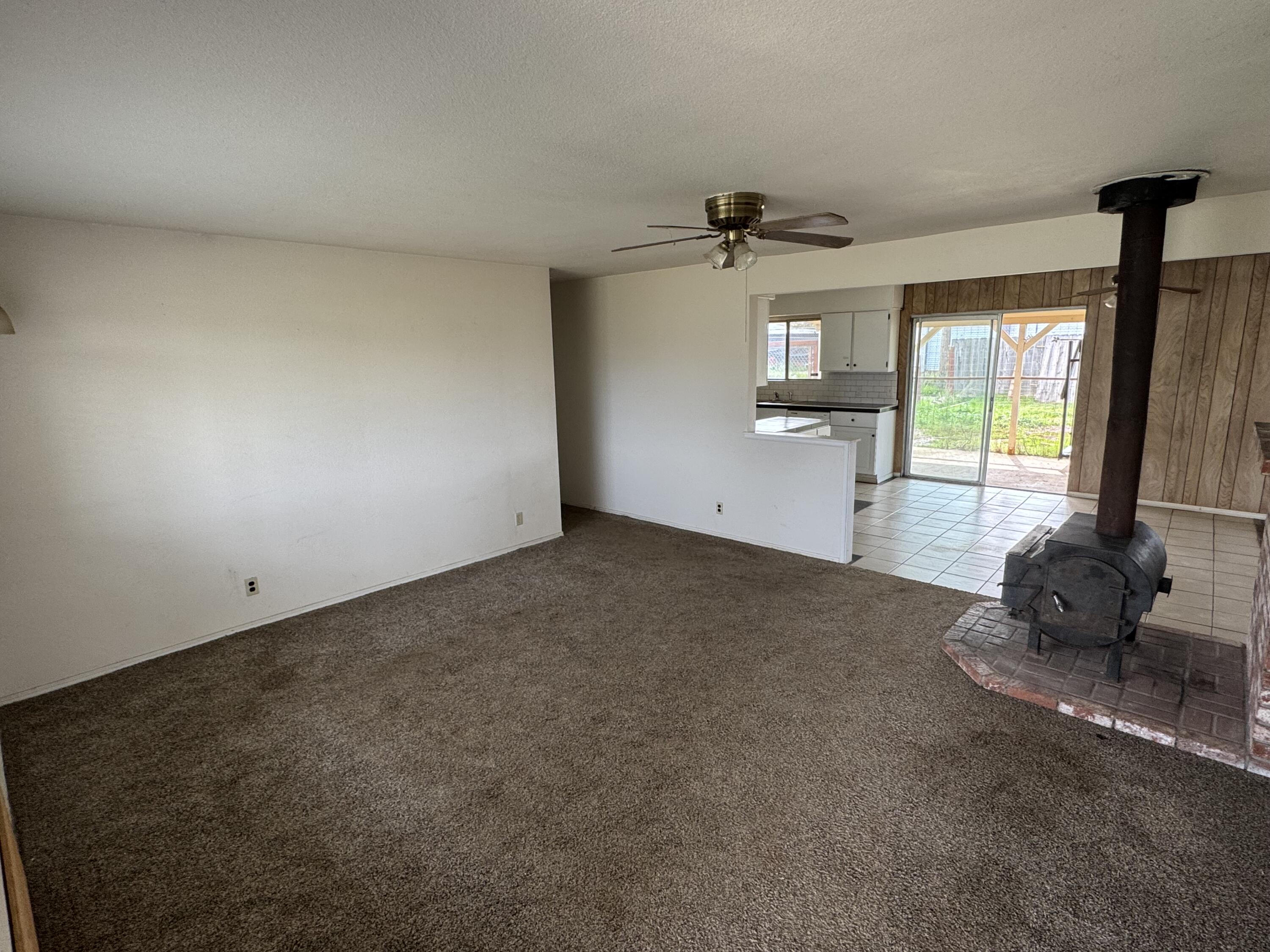 2971-2951 Tarmac Road Redding, CA 96003 - Photo 3 of 32 a room with window and a ceiling fan