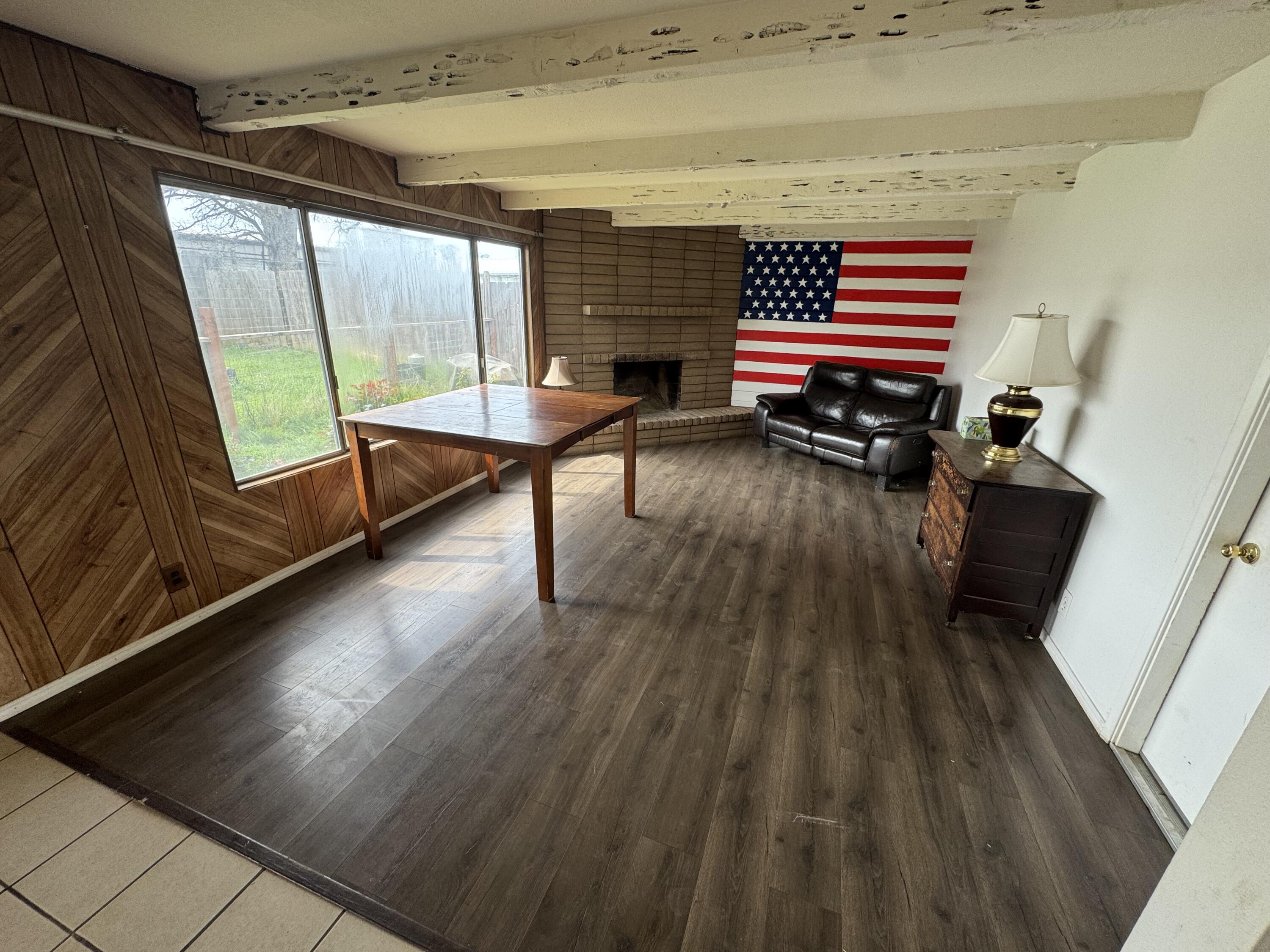 2971-2951 Tarmac Road Redding, CA 96003 - Photo 5 of 32 a living room with furniture a wooden floor and a window