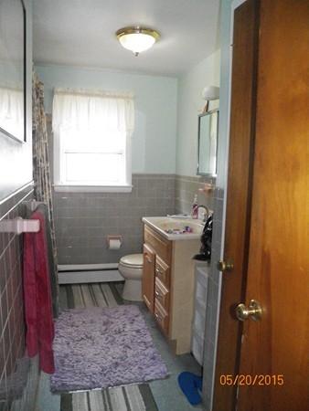 246 Kingsley Road Hull, MA 02045 - Photo 11 of 14 a bathroom with a sink toilet and window