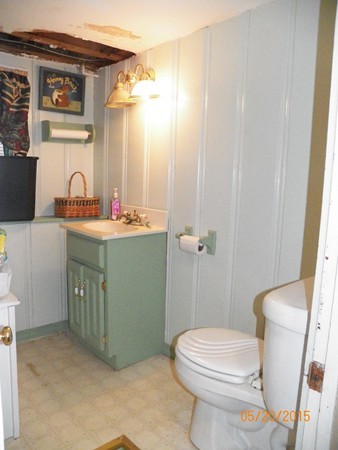 246 Kingsley Road Hull, MA 02045 - Photo 13 of 14 a bathroom with a sink a toilet and mirror