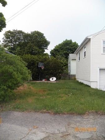246 Kingsley Road Hull, MA 02045 - Photo 14 of 14 a backyard of a house with lots of green space