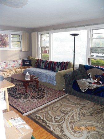 246 Kingsley Road Hull, MA 02045 - Photo 5 of 14 a living room with furniture and a large window