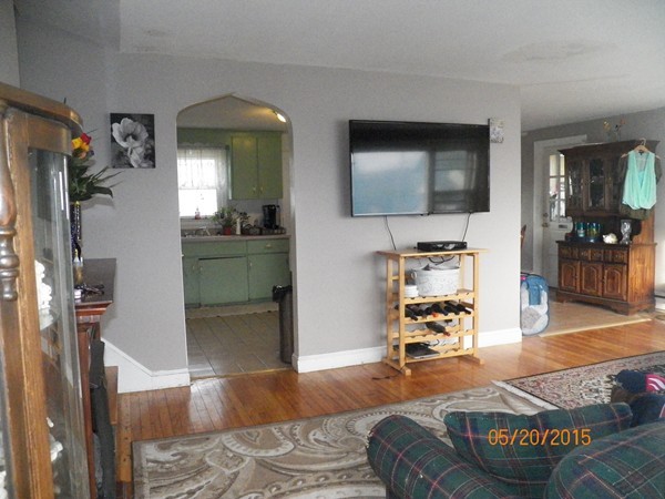246 Kingsley Road Hull, MA 02045 - Photo 7 of 14 a living room with furniture and a flat screen tv