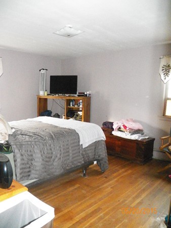 246 Kingsley Road Hull, MA 02045 - Photo 8 of 14 a bed sitting in a bedroom and a flat screen tv