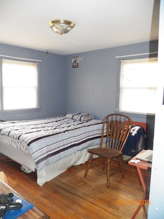 246 Kingsley Road Hull, MA 02045 - Photo 10 of 14 a bedroom with a bed and a window