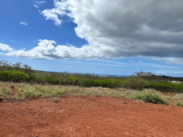 a view of lake with mountain in background