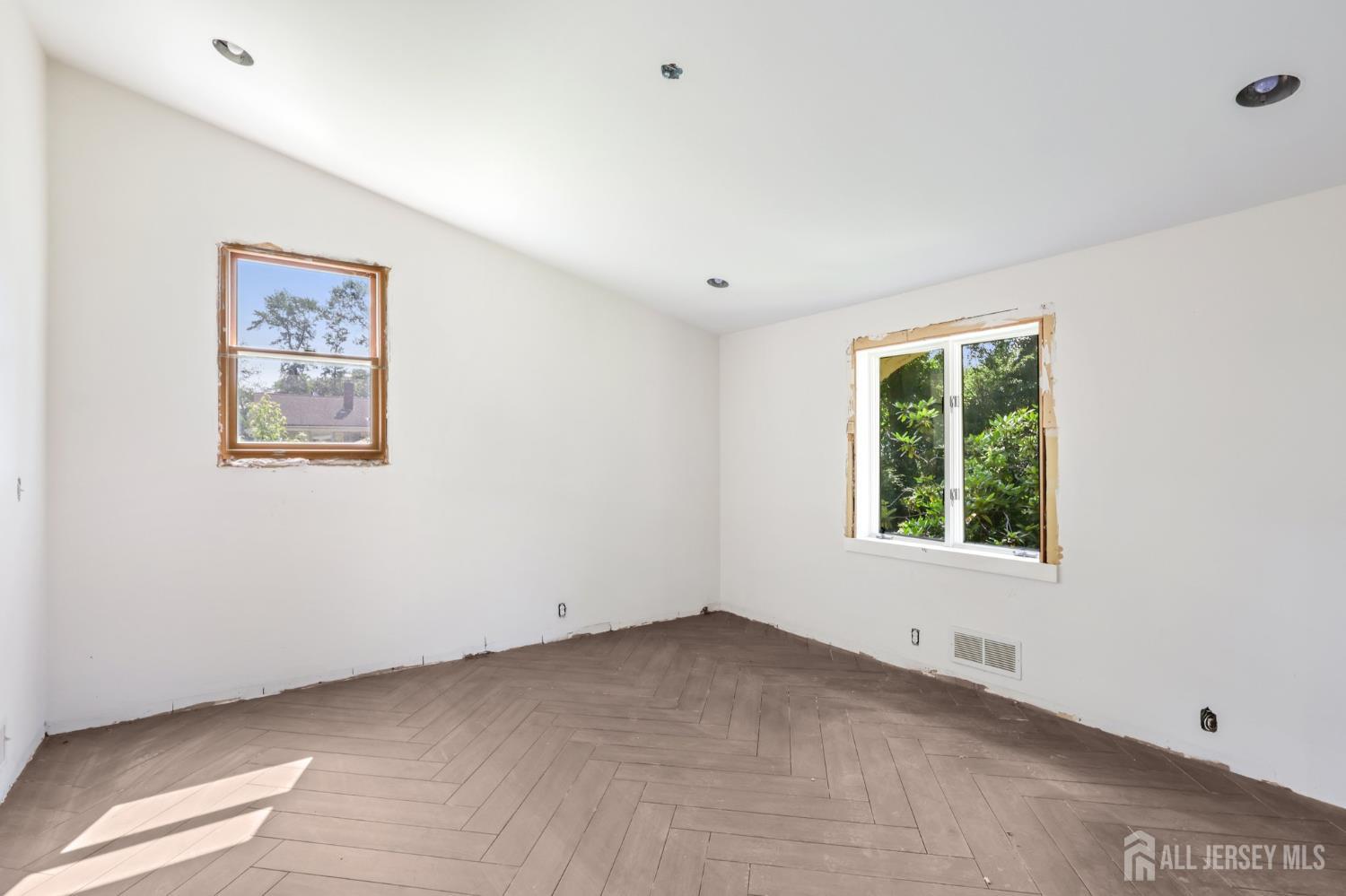 21 Windsor Lane Colonia, NJ 07067 - Photo 15 of 18 a view of an empty room with a window