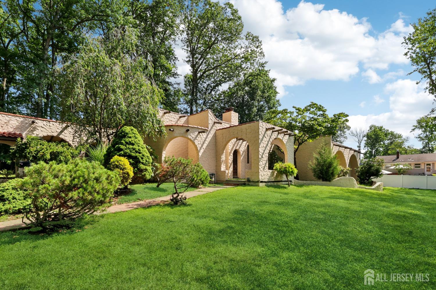 21 Windsor Lane Colonia, NJ 07067 - Photo 2 of 18 a view of a garden with large trees