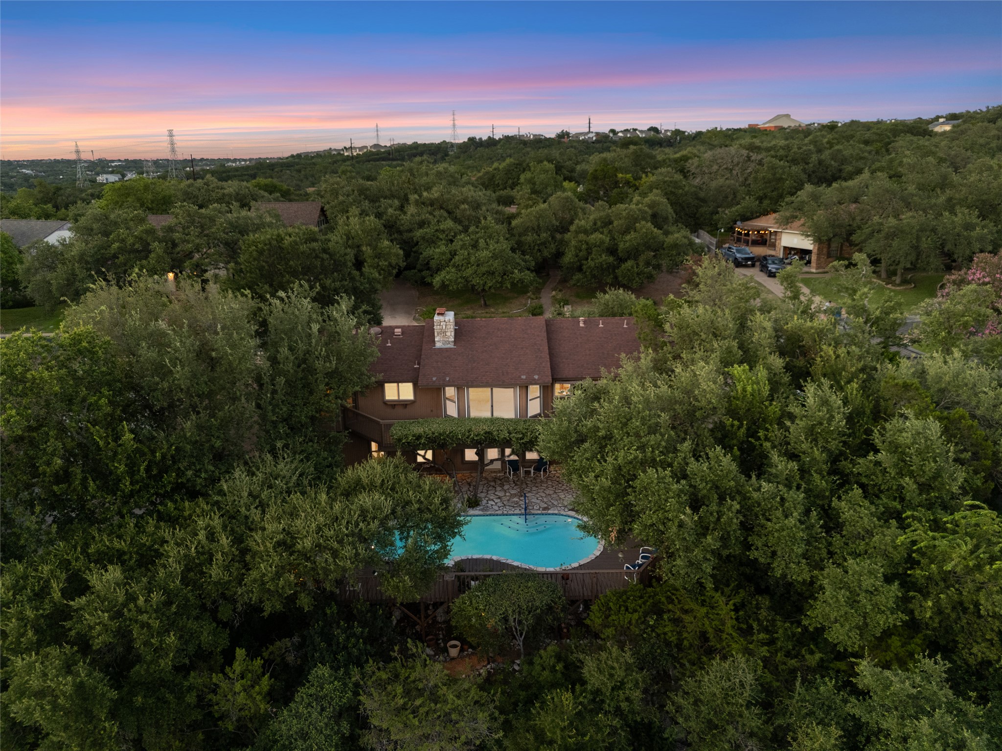 5319 Musket Ridge Austin, TX 78759 - Photo 39 of 39 Perched among verdant trees, this property offers a private pool and ample parking, creating a secluded retreat.