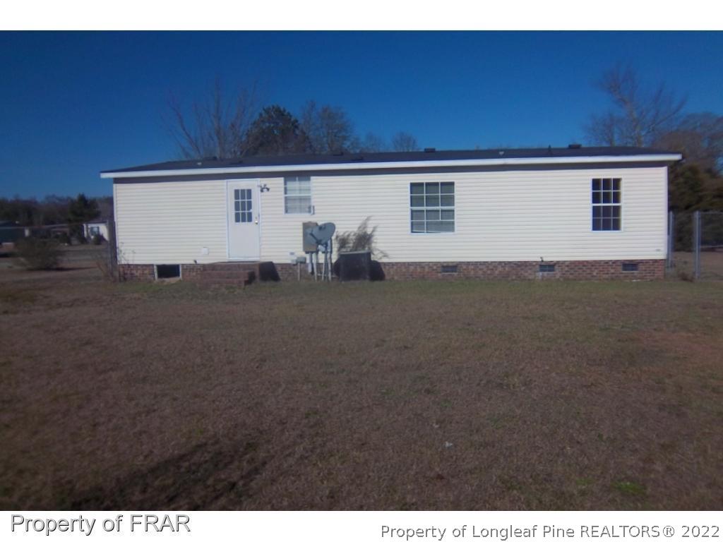 6532 Sandy Creek Road Stedman, NC 28391 - Photo 2 of 5 a view of a house with a yard