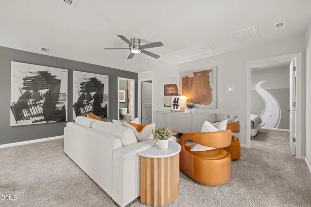 a living room with patio furniture and a large window