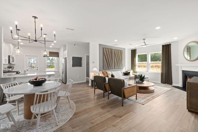 a living room with furniture and fireplace