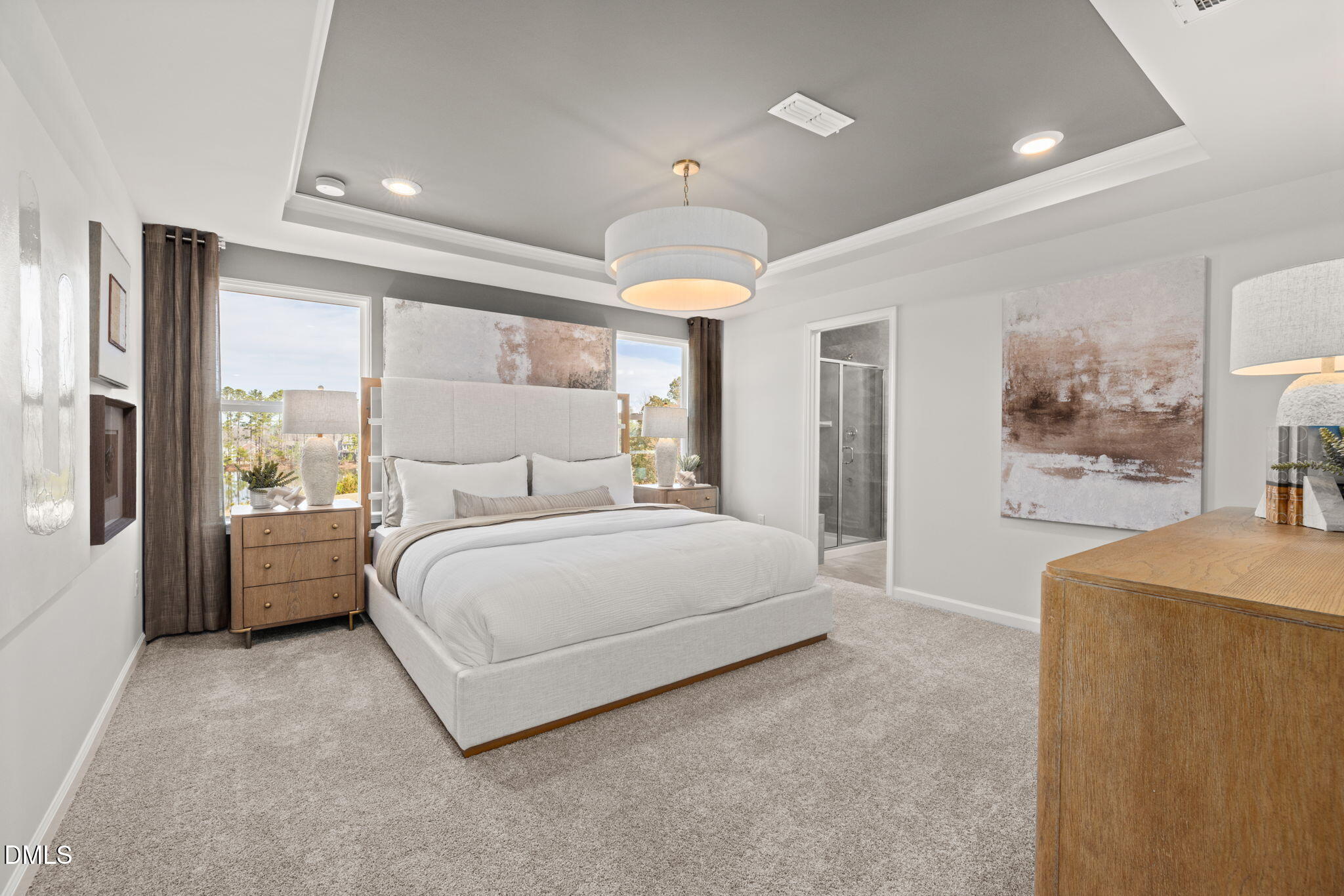 1451 Rowboat Road Apex, NC 27502 - Photo 7 of 20 a spacious bedroom with a large bed and a chandelier