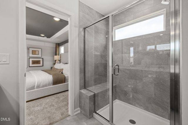 a bathroom with a tub and shower