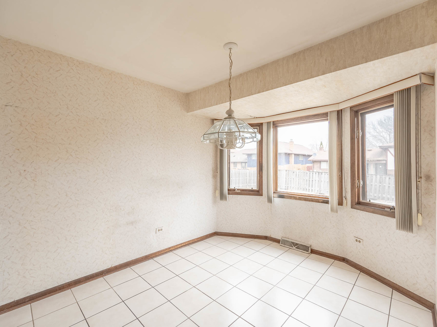 18549 Old Farm Road Lansing, IL 60438 - Photo 6 of 16 a view of an empty room with a window