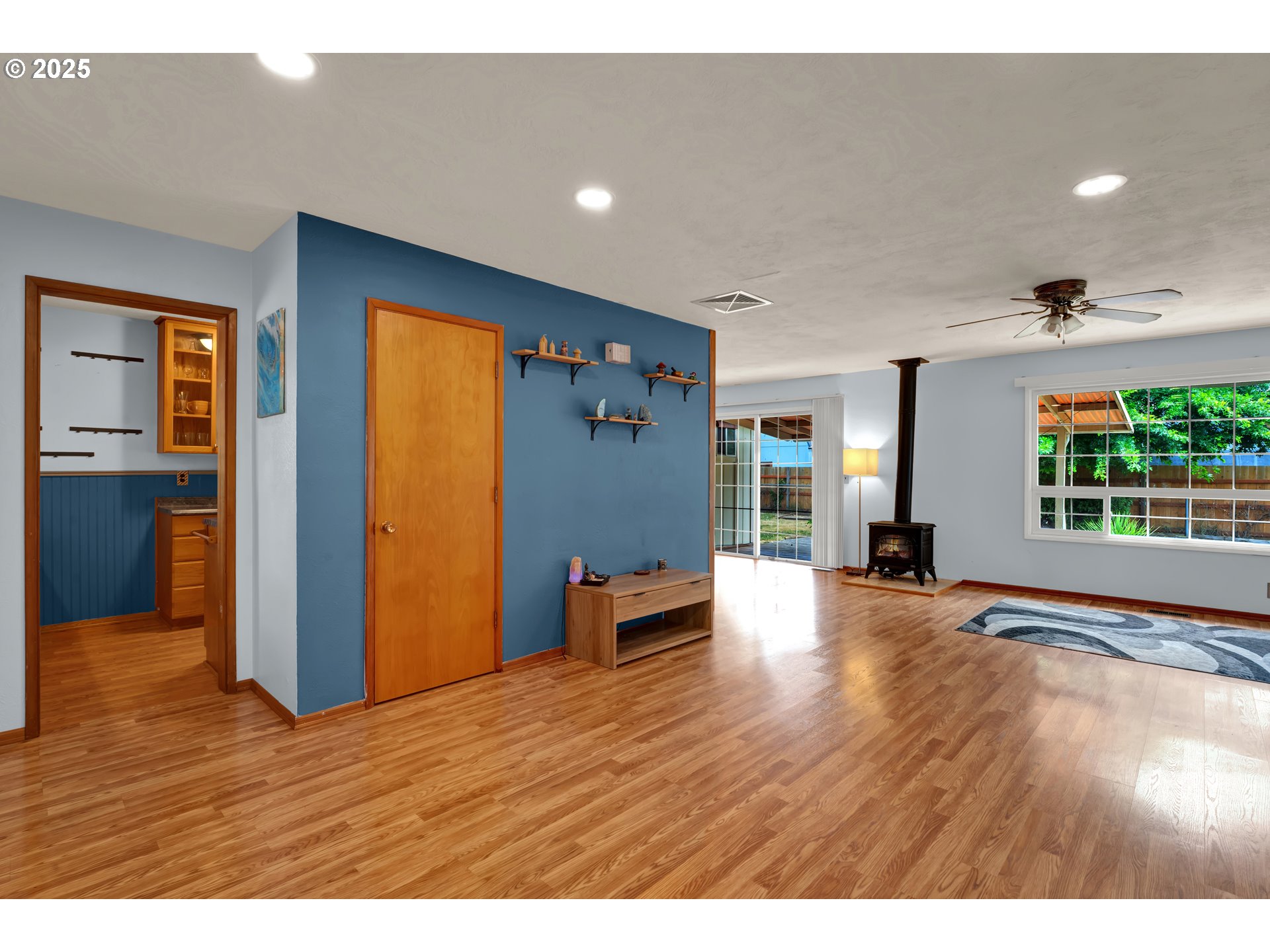 2919 Oak Street Southeast Albany, OR 97322 - Photo 8 of 36 a view of an empty room with wooden floor and a window