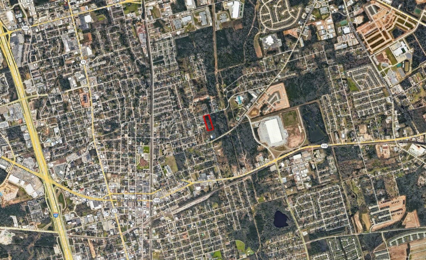 0 East Dallas Street Conroe, TX 77301 - Photo 2 of 3 view of a brick building