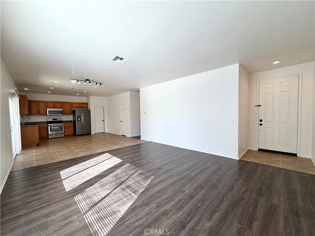 a view of kitchen with furniture and wooden floor