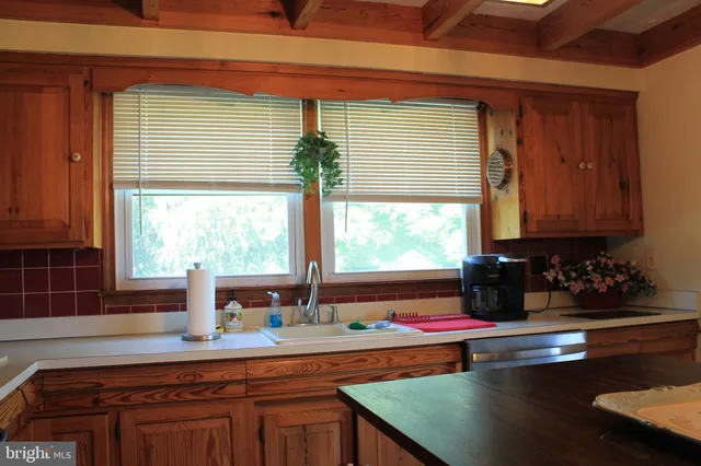 a view of a swimming pool and trees in the background