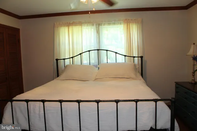 a backyard of a house with a yard and outdoor seating