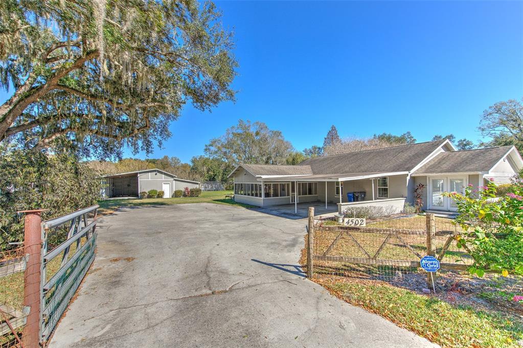 4502 Old Mulberry Road Plant City, FL 33567 - Photo 1 of 1 a view of a house with a yard