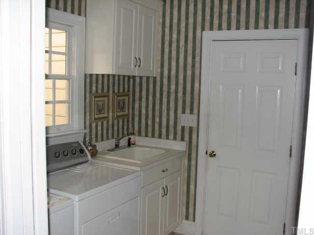 3205 Tanager Street Raleigh, NC 27606 - Photo 12 of 12 Combination laundry, mudroom with built in computer table off kitchen
