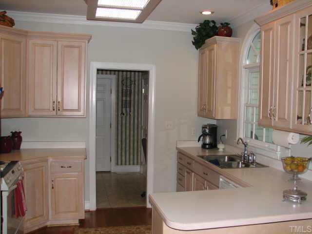3205 Tanager Street Raleigh, NC 27606 - Photo 3 of 12 Very functional kitchen steps away from the computer table in the combination mudroom/laundry.