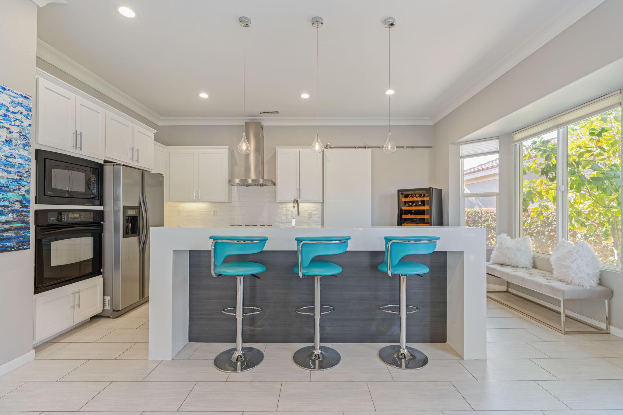 2 Pyramid Lake Court Rancho Mirage, CA 92270 - Photo 11 of 49 a kitchen with stainless steel appliances kitchen island granite countertop a refrigerator and a stove top oven