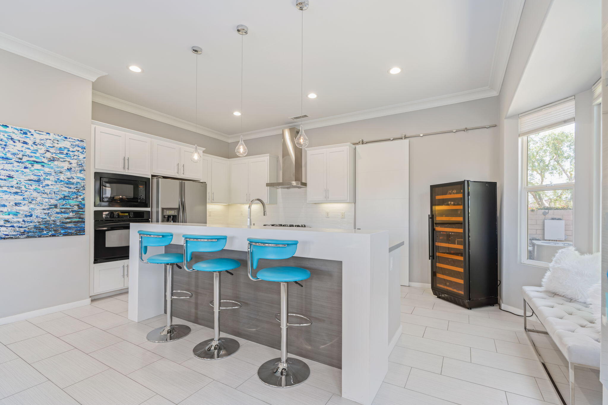 2 Pyramid Lake Court Rancho Mirage, CA 92270 - Photo 12 of 49 a kitchen with stainless steel appliances kitchen island granite countertop a refrigerator and a stove top oven