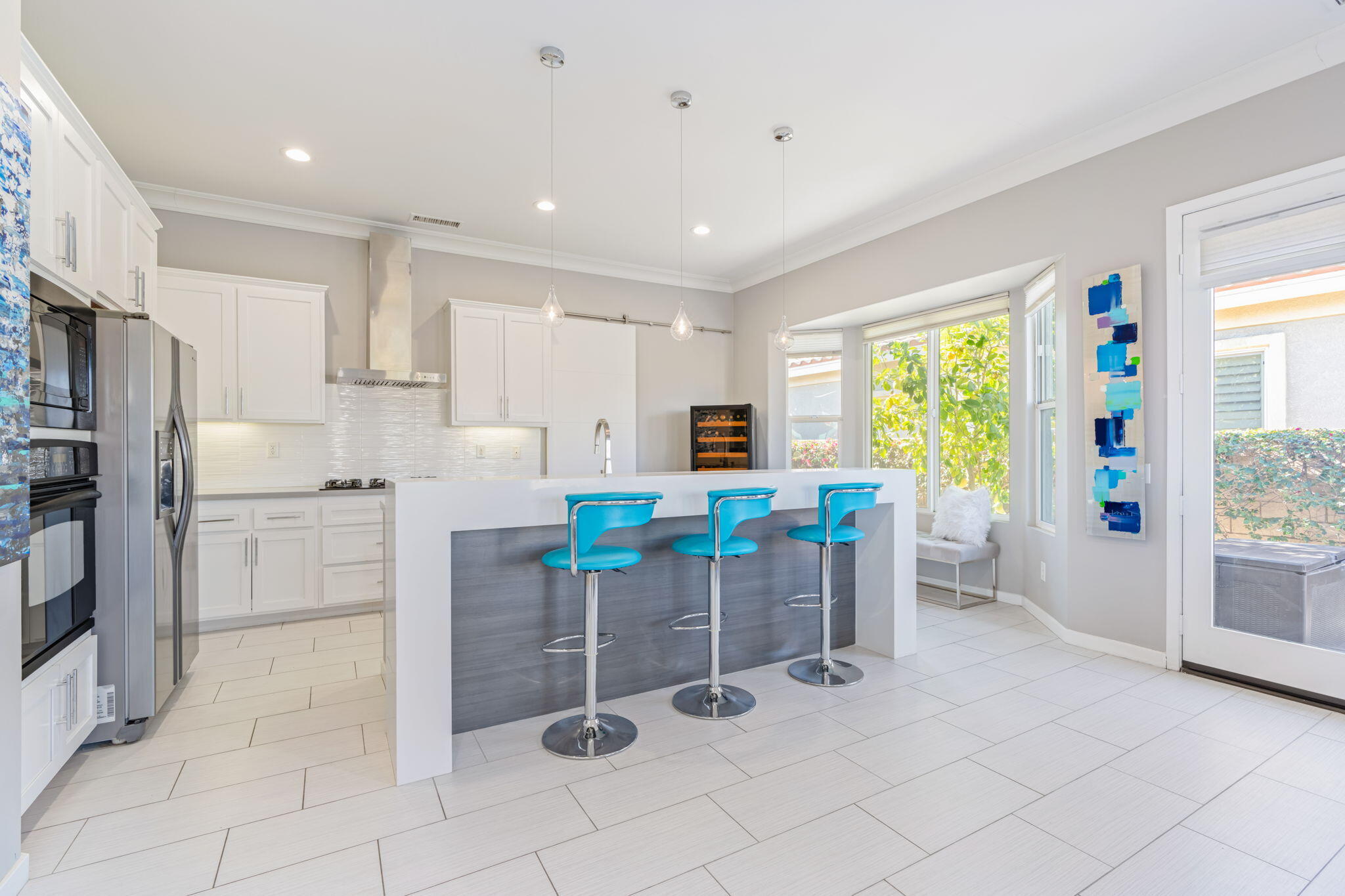 2 Pyramid Lake Court Rancho Mirage, CA 92270 - Photo 13 of 49 a kitchen with stainless steel appliances kitchen island granite countertop a refrigerator and a stove top oven