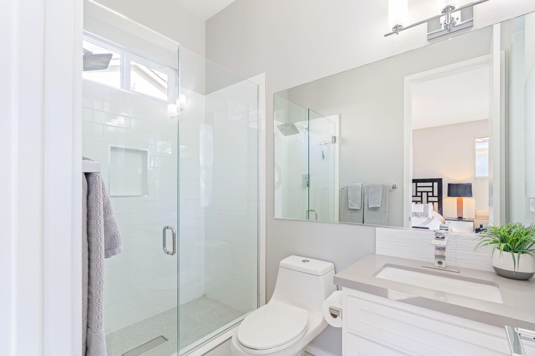 2 Pyramid Lake Court Rancho Mirage, CA 92270 - Photo 46 of 49 a bathroom with a granite countertop sink toilet a shower and a mirror
