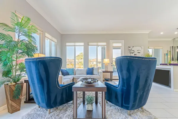 a kitchen with stainless steel appliances kitchen island granite countertop a refrigerator and a stove top oven