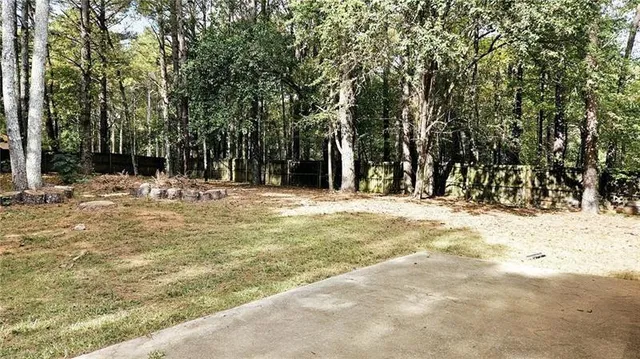 a view of swimming pool with a yard