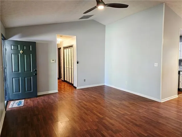 a view of a livingroom with wooden floor