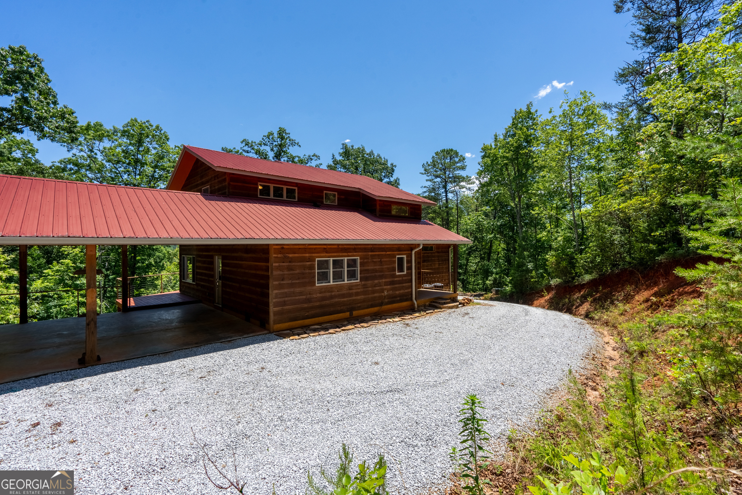 420 Hidden Acres Lane Clayton, GA 30525 - Photo 12 of 46 a front view of a house with a yard and garage